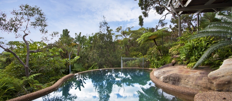 Building a Retaining Wall Around Your Pool On A Sloped Backyard